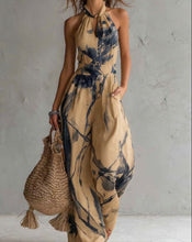 New halter backless jumpsuit, blue and white tie-dye wide-leg pants.