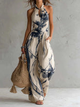 New halter backless jumpsuit, blue and white tie-dye wide-leg pants.