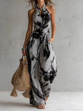 New halter backless jumpsuit, blue and white tie-dye wide-leg pants.