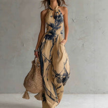 New halter backless jumpsuit, blue and white tie-dye wide-leg pants.