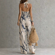 New halter backless jumpsuit, blue and white tie-dye wide-leg pants.